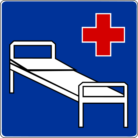 Znak szpitalnego łóżka. Uproszczony symbol łóżka na niebieskim tle. Obok symbol czerwonego krzyża szpitalnego.